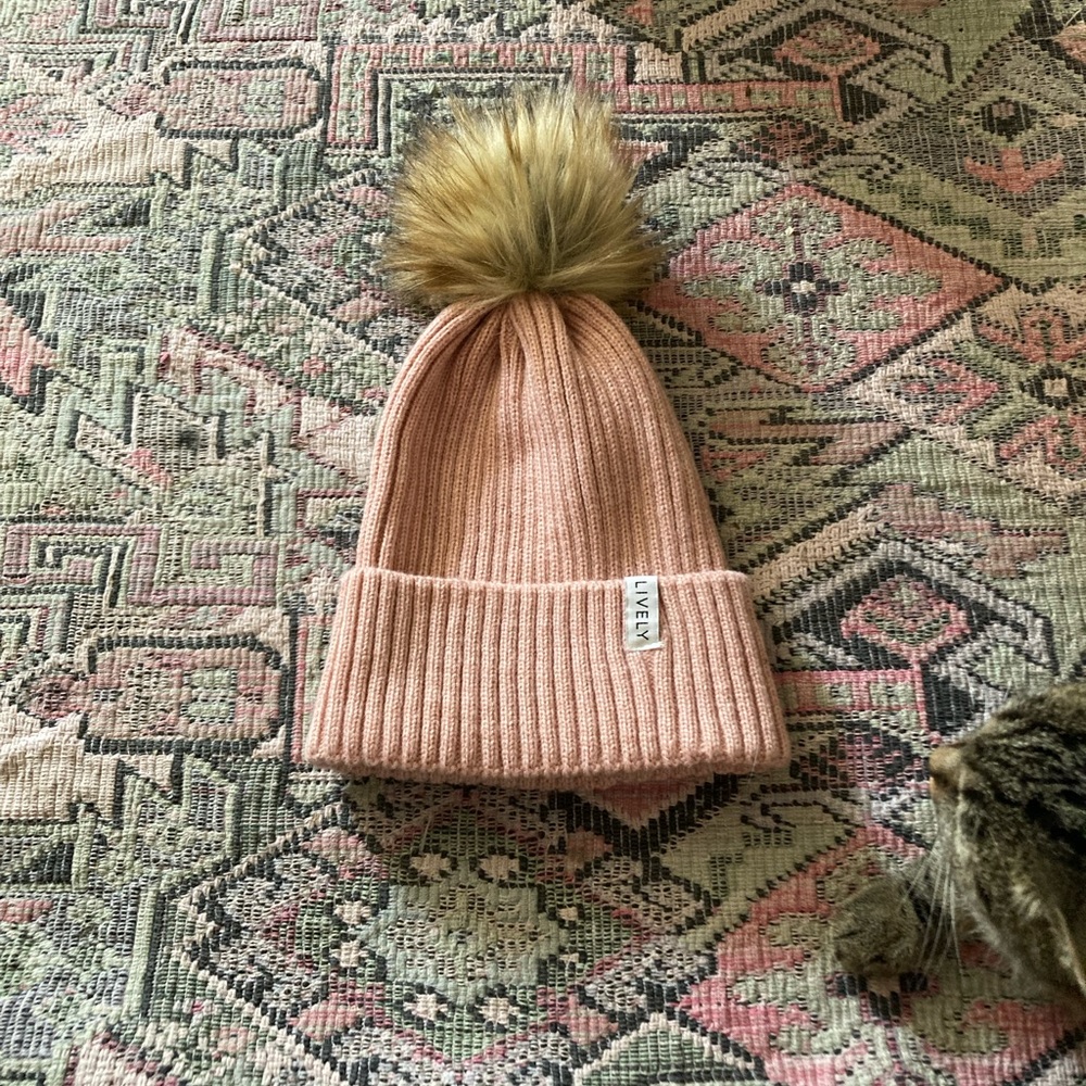 Lively, dusty rose pink, pom pom, knit beanie/hat.